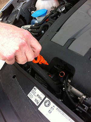 Checking Oil level to make sure there is sufficient oil